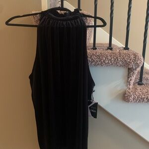 A black sleeveless velvet top